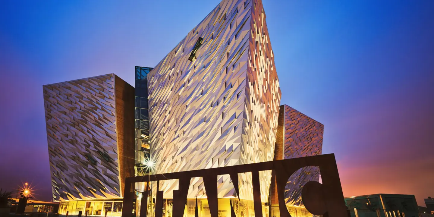 A view of the Titanic exhibition centre lit up at dusk