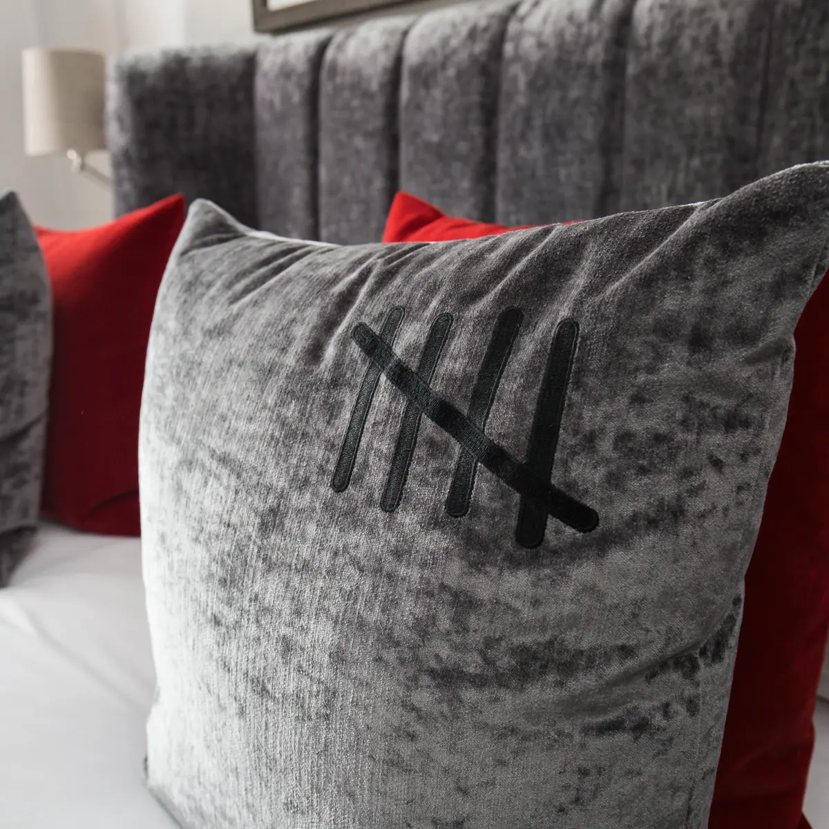 A close-up view of a pillow resting on a bed.