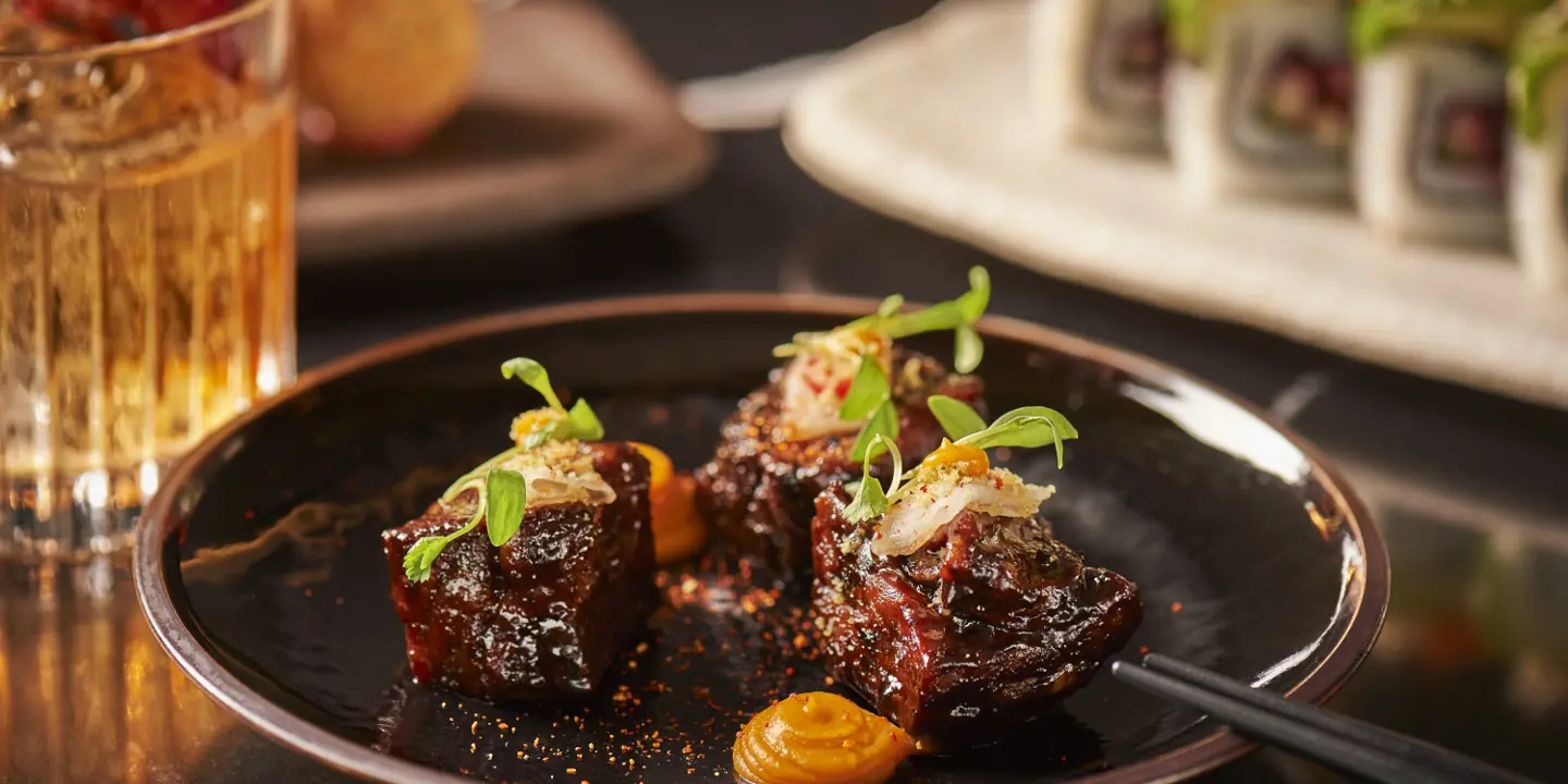 A rooftop seating area with a view of a cathedral