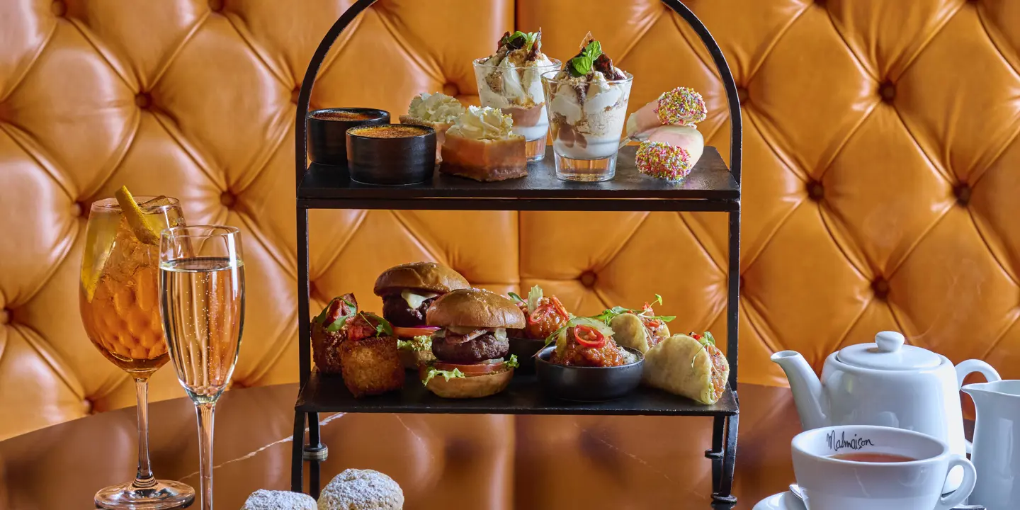 Table adorned with an assortment of mini dishes and cocktails.