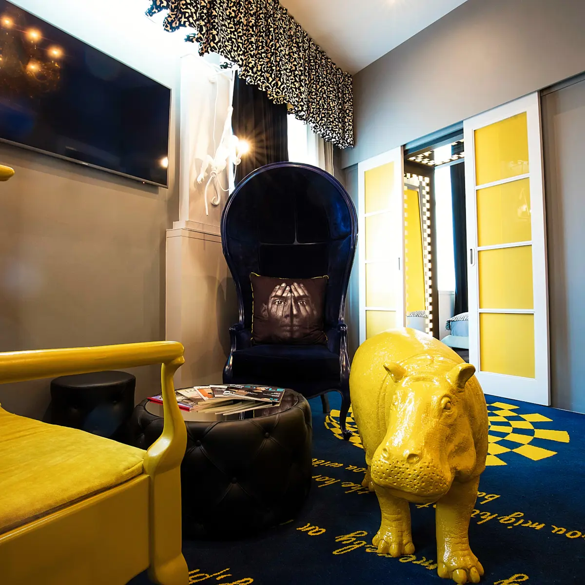 Living room featuring a fireplace and yellow furniture.