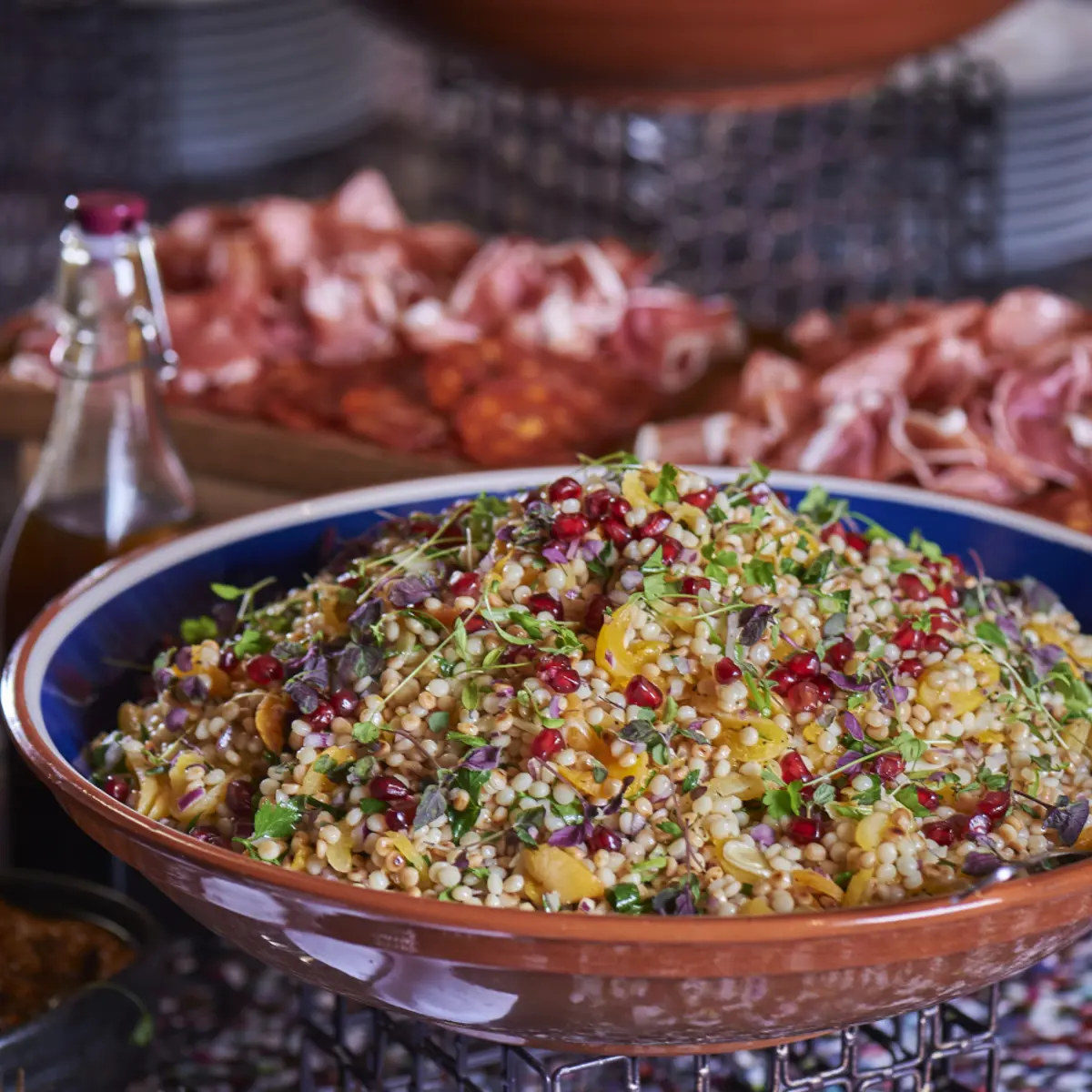 Bowl of salad on a table.